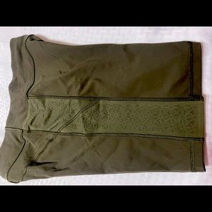 Lululemon olive green high rise shorts w/pockets with mesh designs.